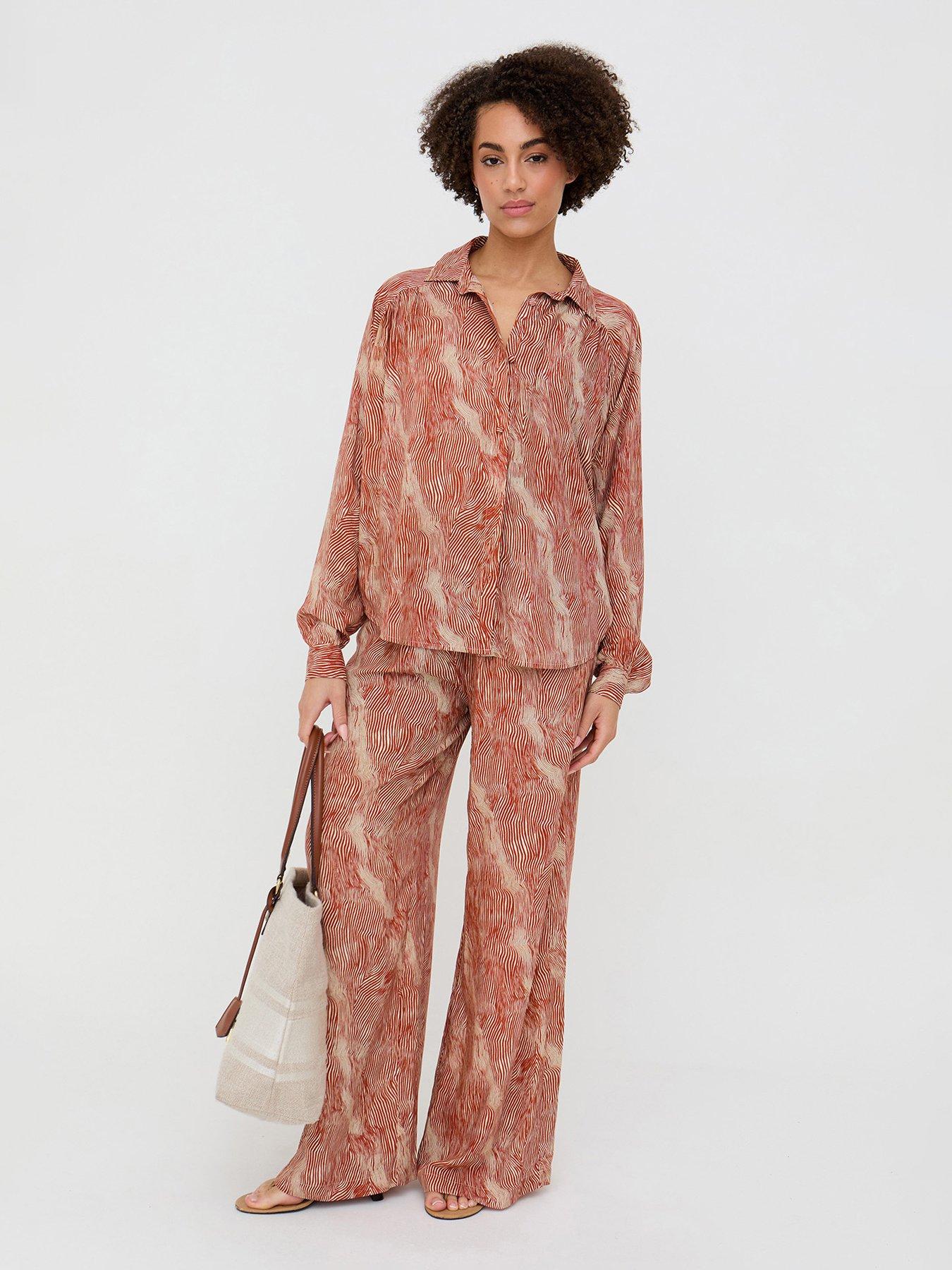  image of raffya-ginger-button-down-tiger-print-shirt-in-ginger-orange