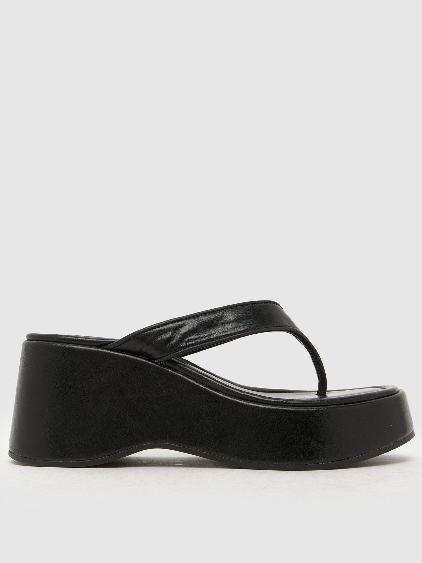 front image of schuh-tonio-chunky-toe-post-sandal-black
