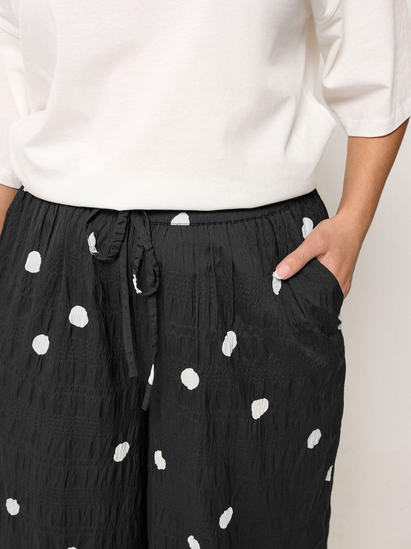 Image 4 of 5 of Yours Curve Woven Polka Dot Printed Trousers - Black