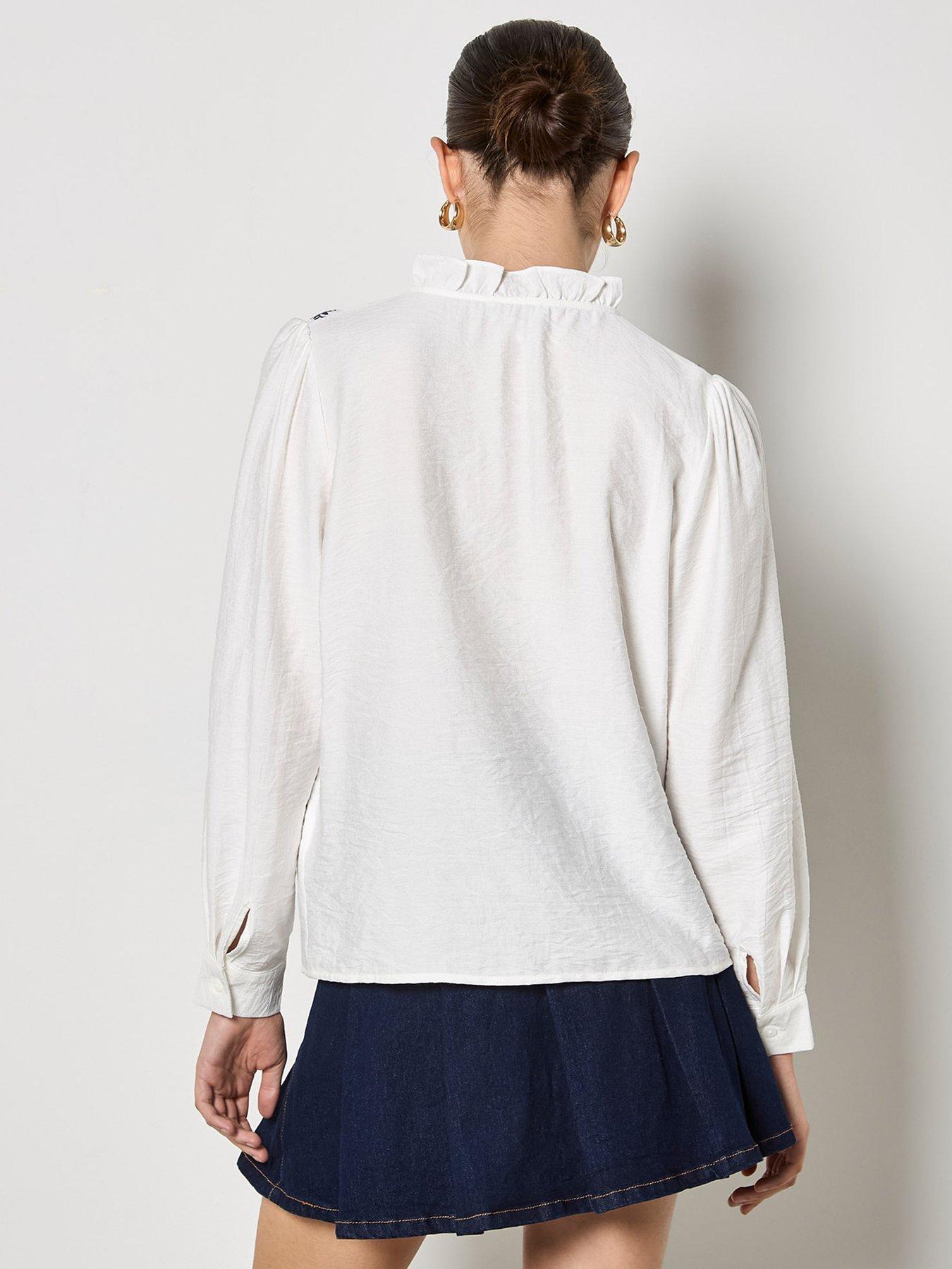  image of apricot-ruffle-neck-embroidered-blouse