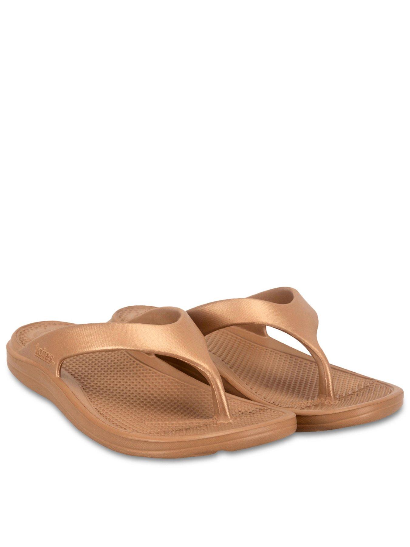 front image of totes-solbounce-ladies-toe-post-gold-metallic