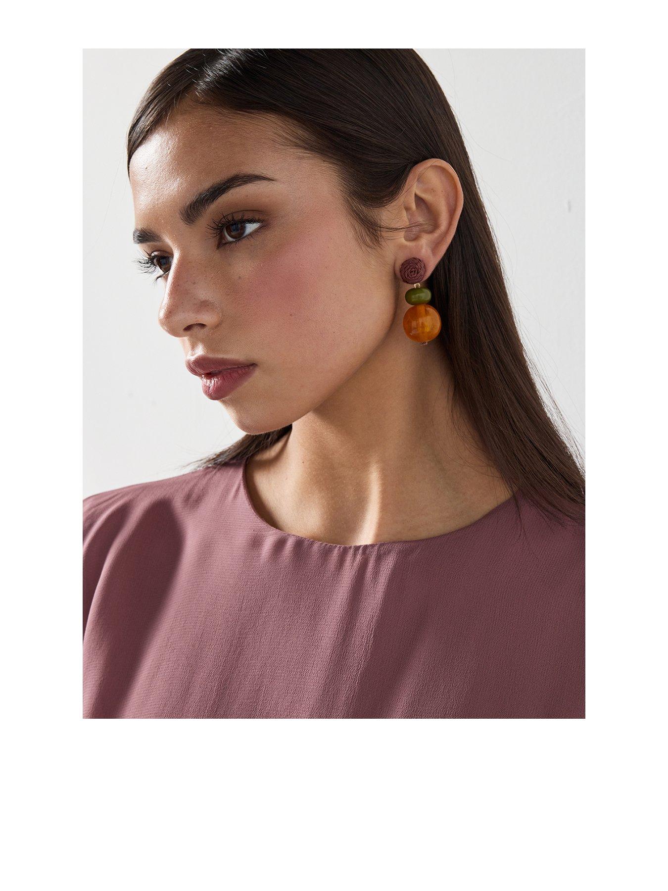 front image of mango-combined-resin-hanging-earrings-orange