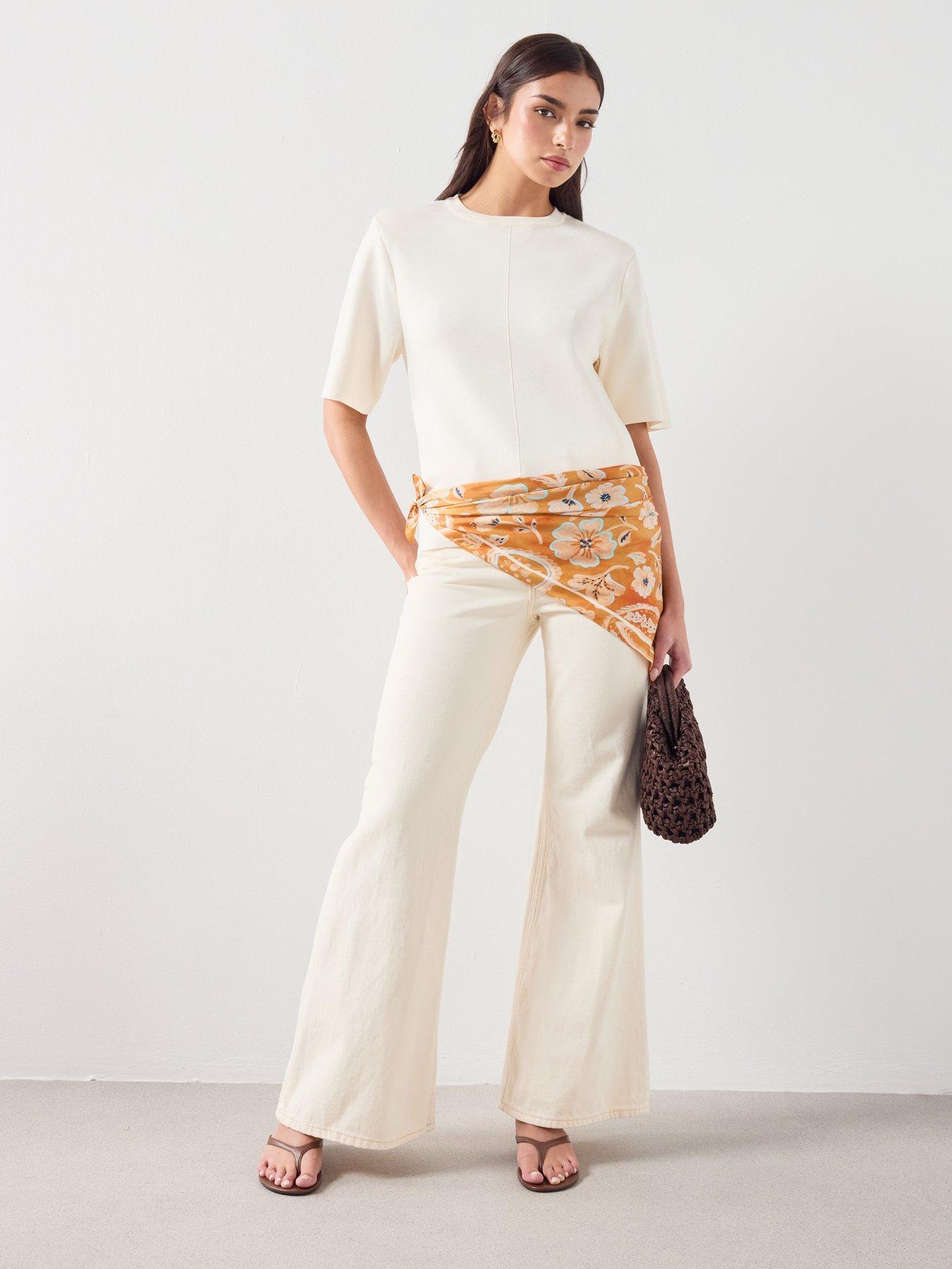  image of mango-mid-rise-flared-jeans-cream