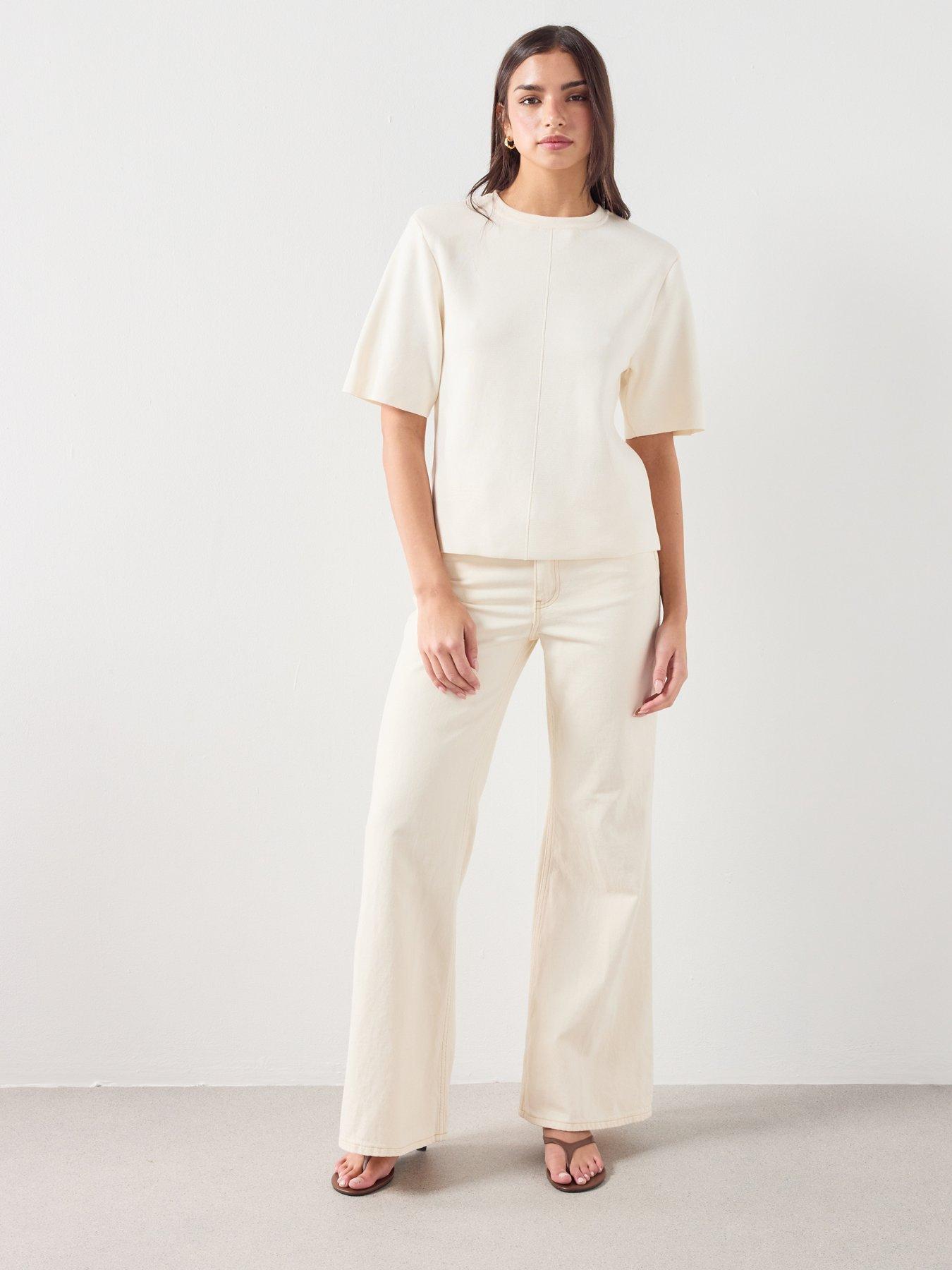  image of mango-mid-rise-flared-jeans-cream