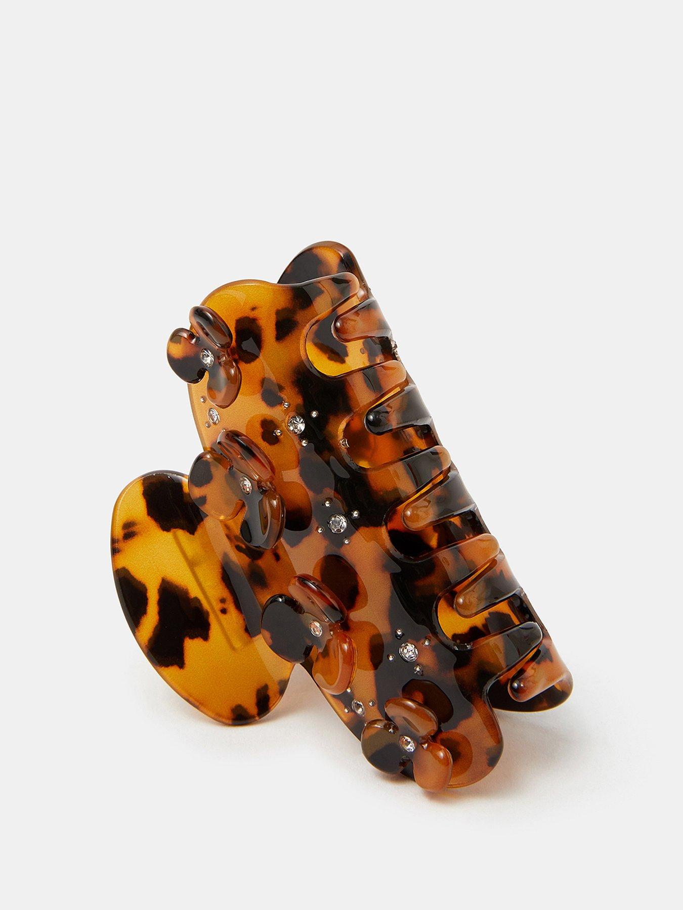  image of accessorize-flower-tort-claw-clip