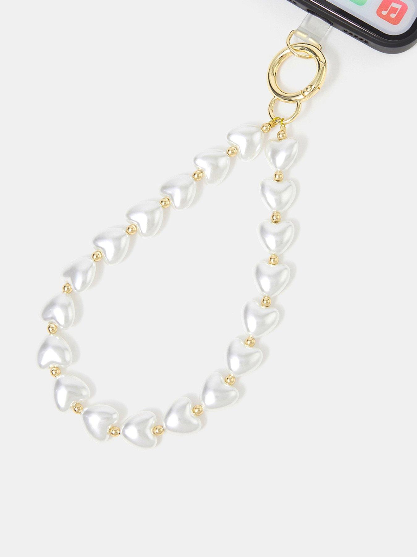Image 1 of 2 of Accessorize Pearl Heart Phone Wrist Strap