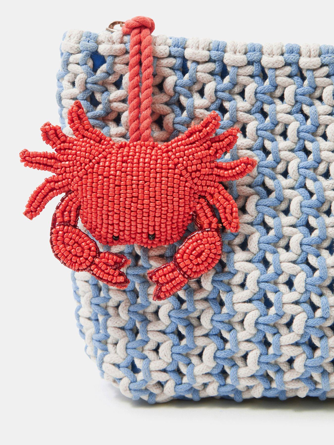 image of accessorize-crab-charm-macrame-clutch-bag