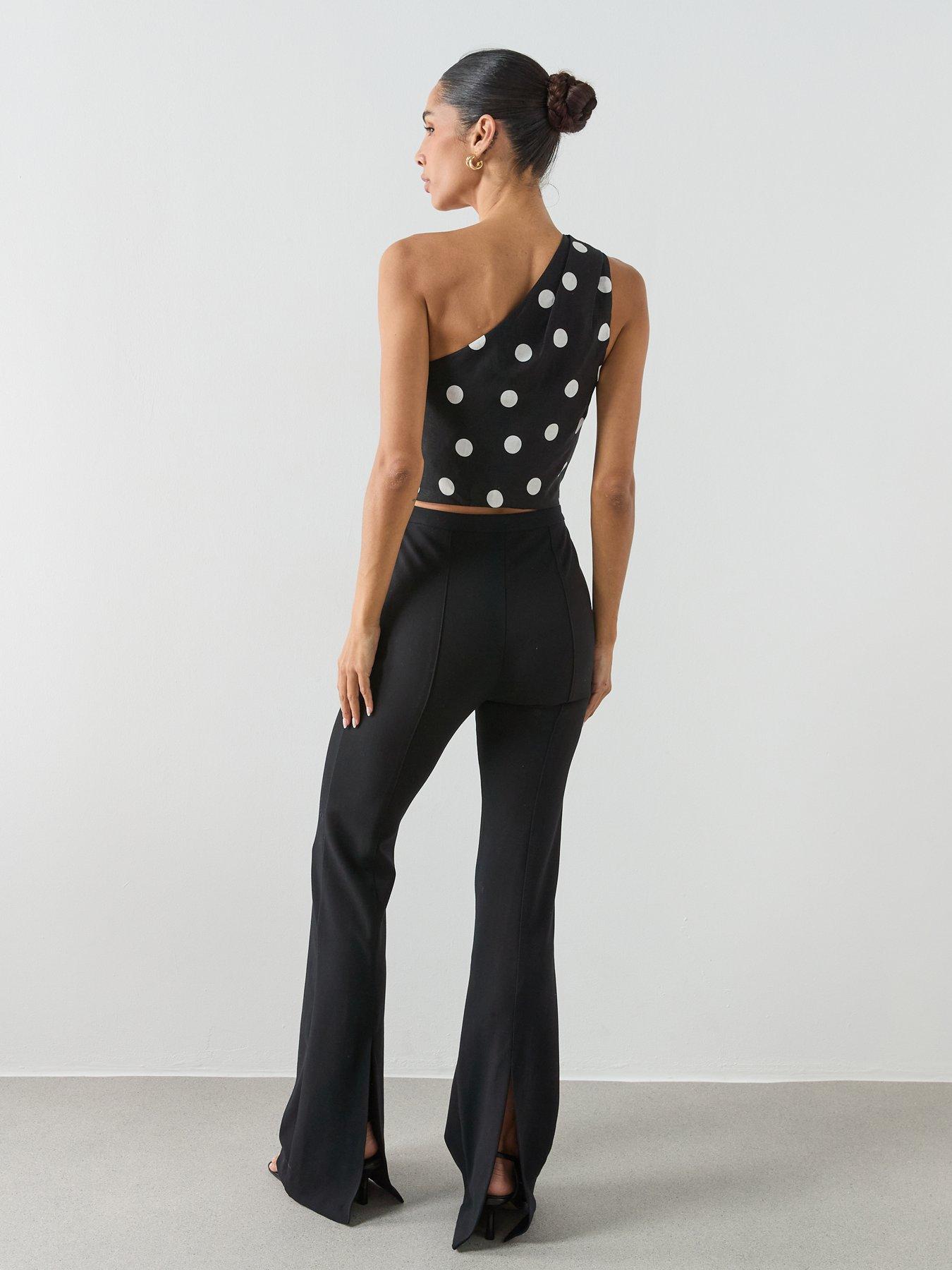 stillFront image of mango-asymmetric-polka-dot-top-black