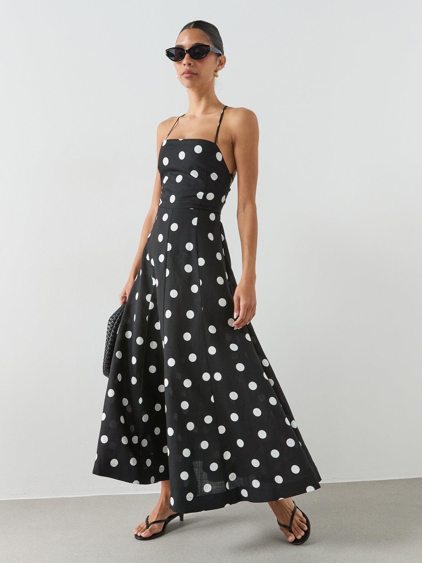 front image of mango-lyocell-polka-dot-dress-black