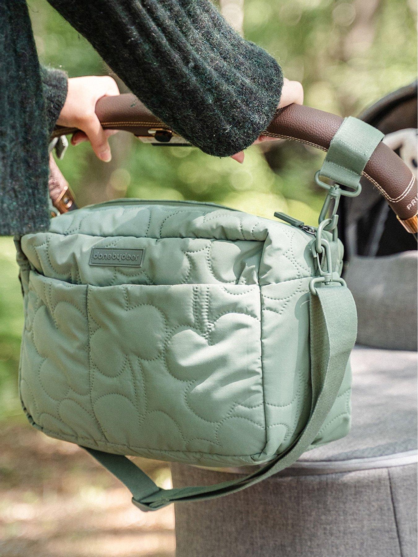  image of done-by-deer-quilted-stroller-bag-green