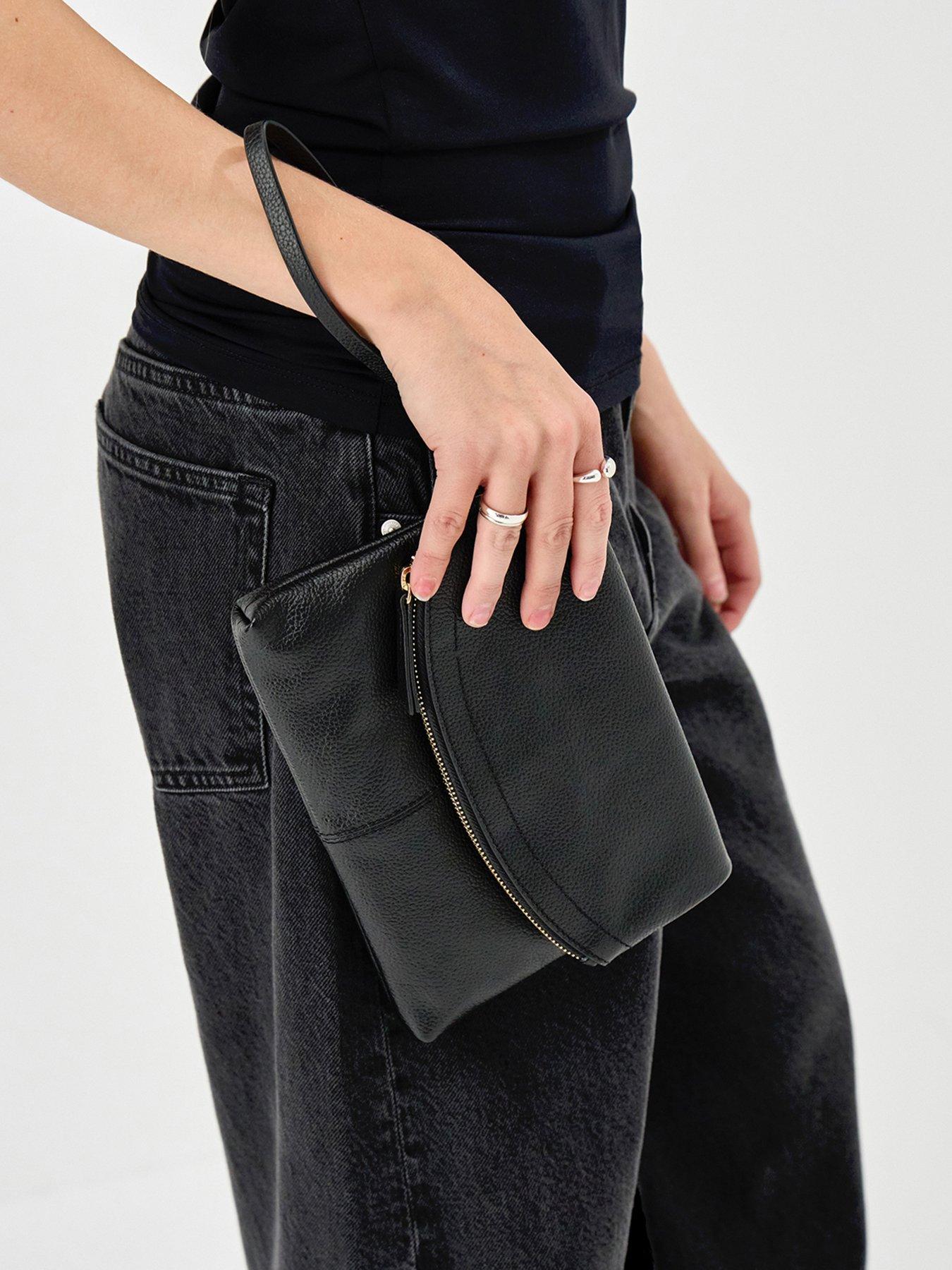 stillFront image of accessorize-curved-foldover-leather-wristlet-bag