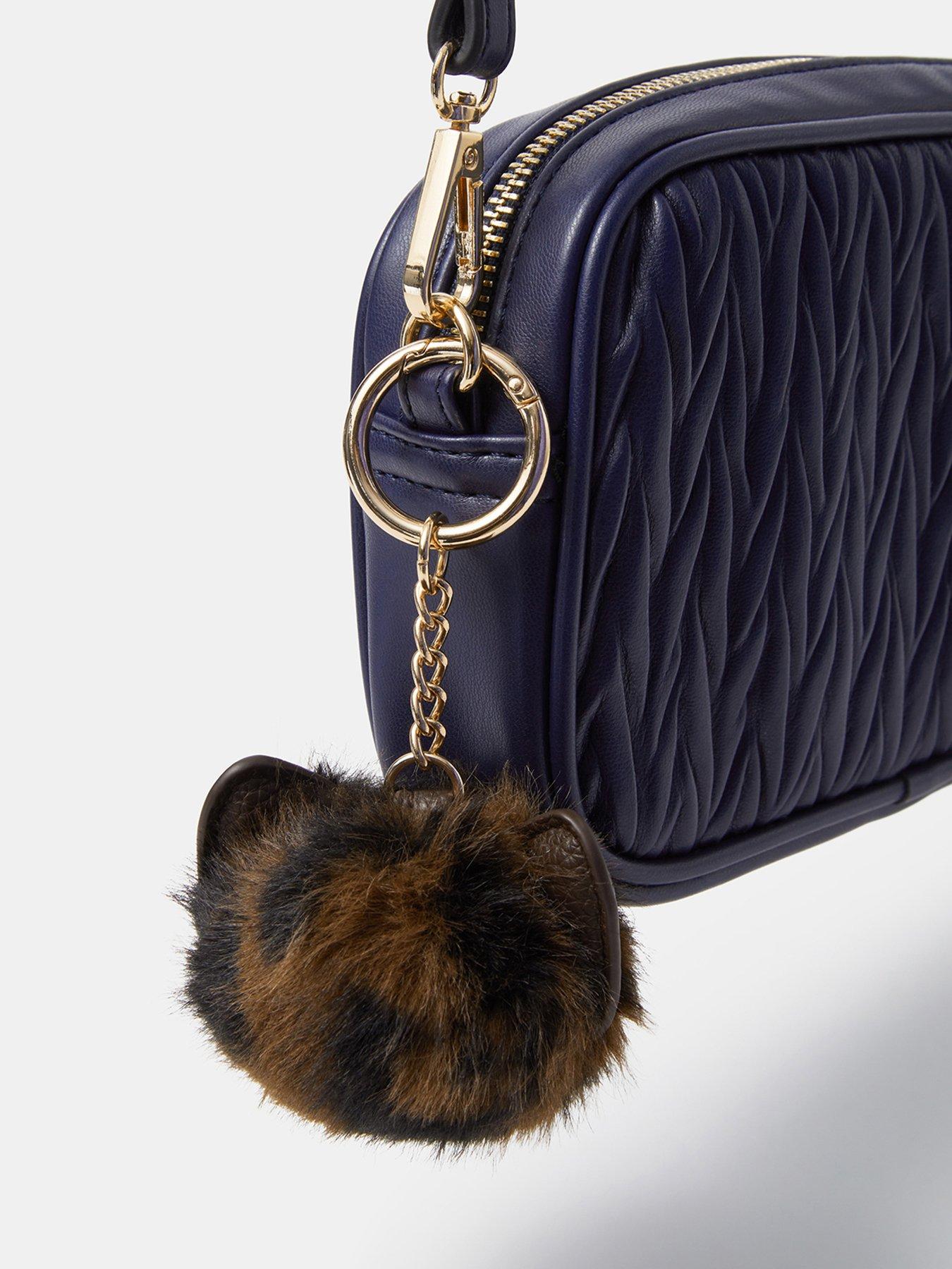 Image 2 of 3 of Accessorize Animal Print Pom Bag Charm