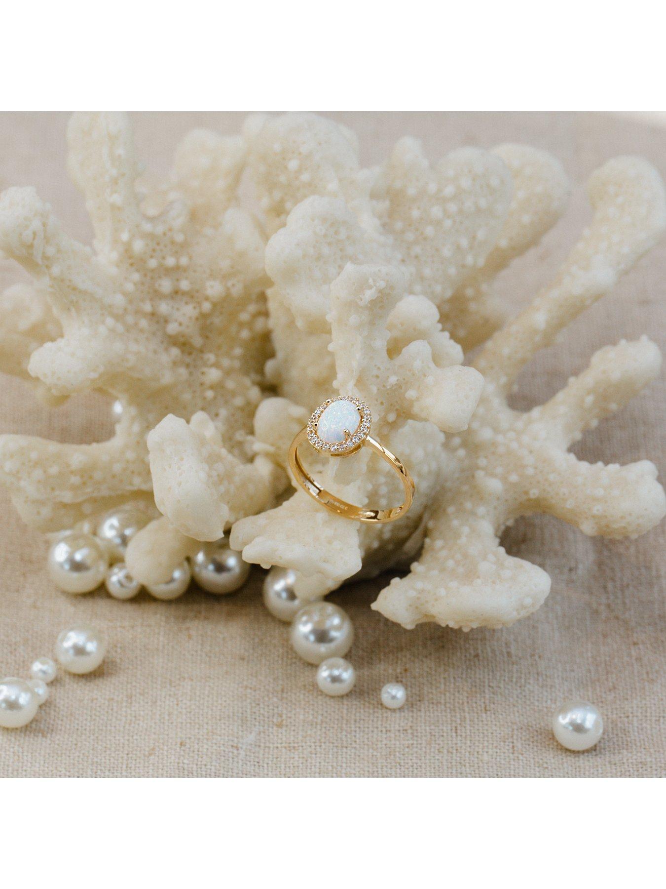  image of the-love-collection-9ct-yellow-gold-cz-and-oval-synthetic-opal-halo-ring