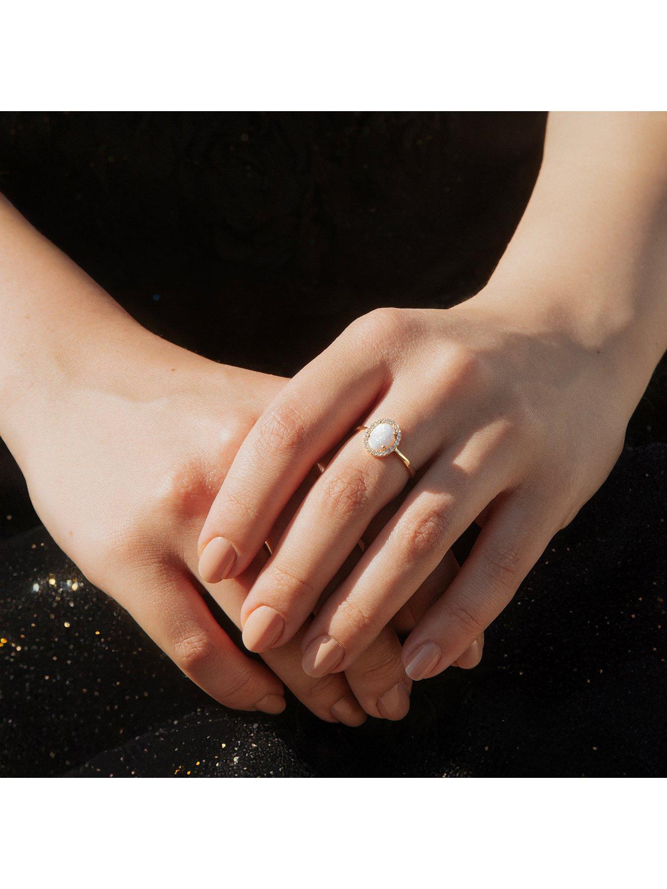  image of the-love-collection-9ct-yellow-gold-cz-and-oval-synthetic-opal-halo-ring