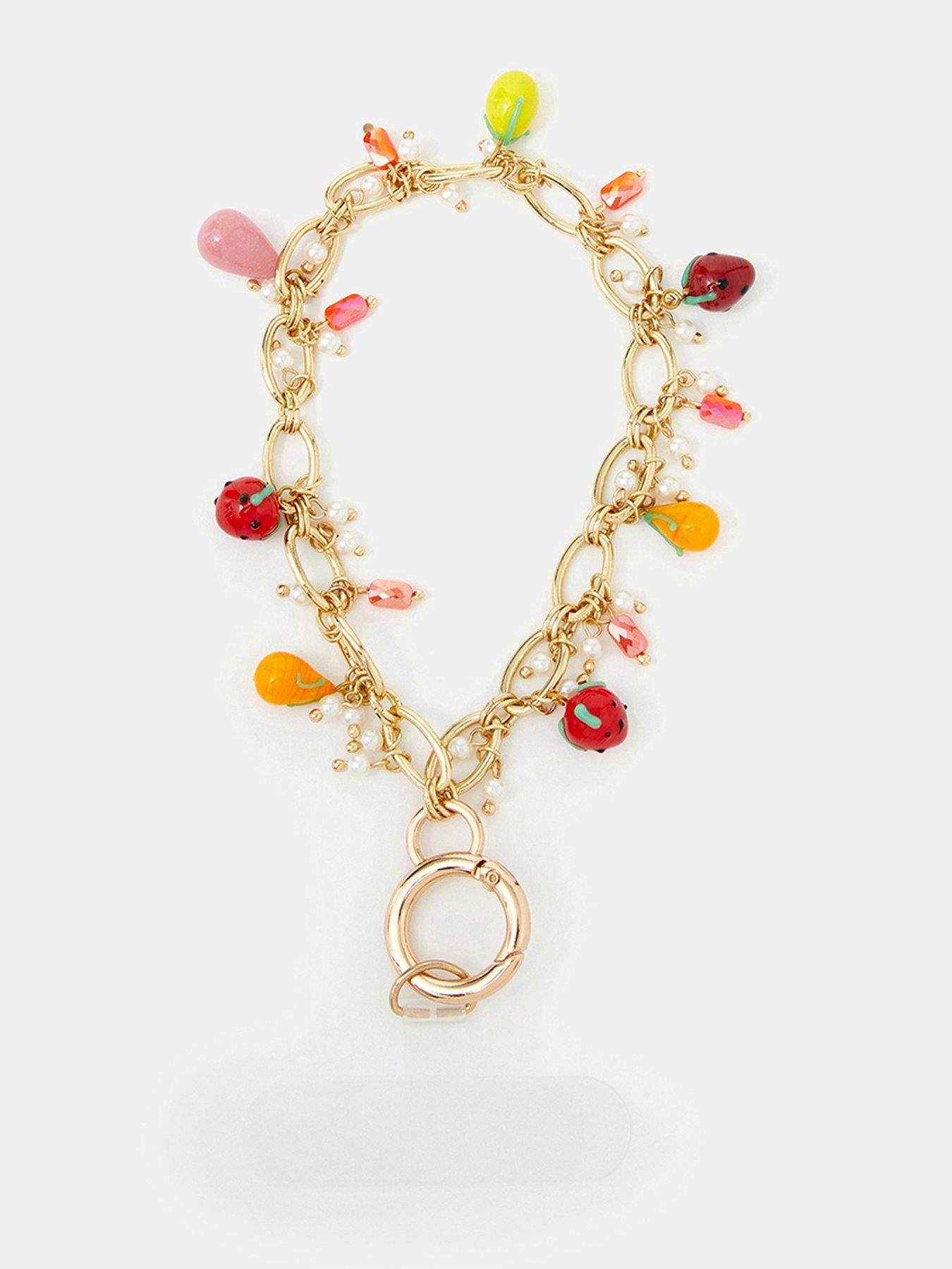 Image 1 of 4 of Accessorize Fruit Charm Wrist Phone Strap