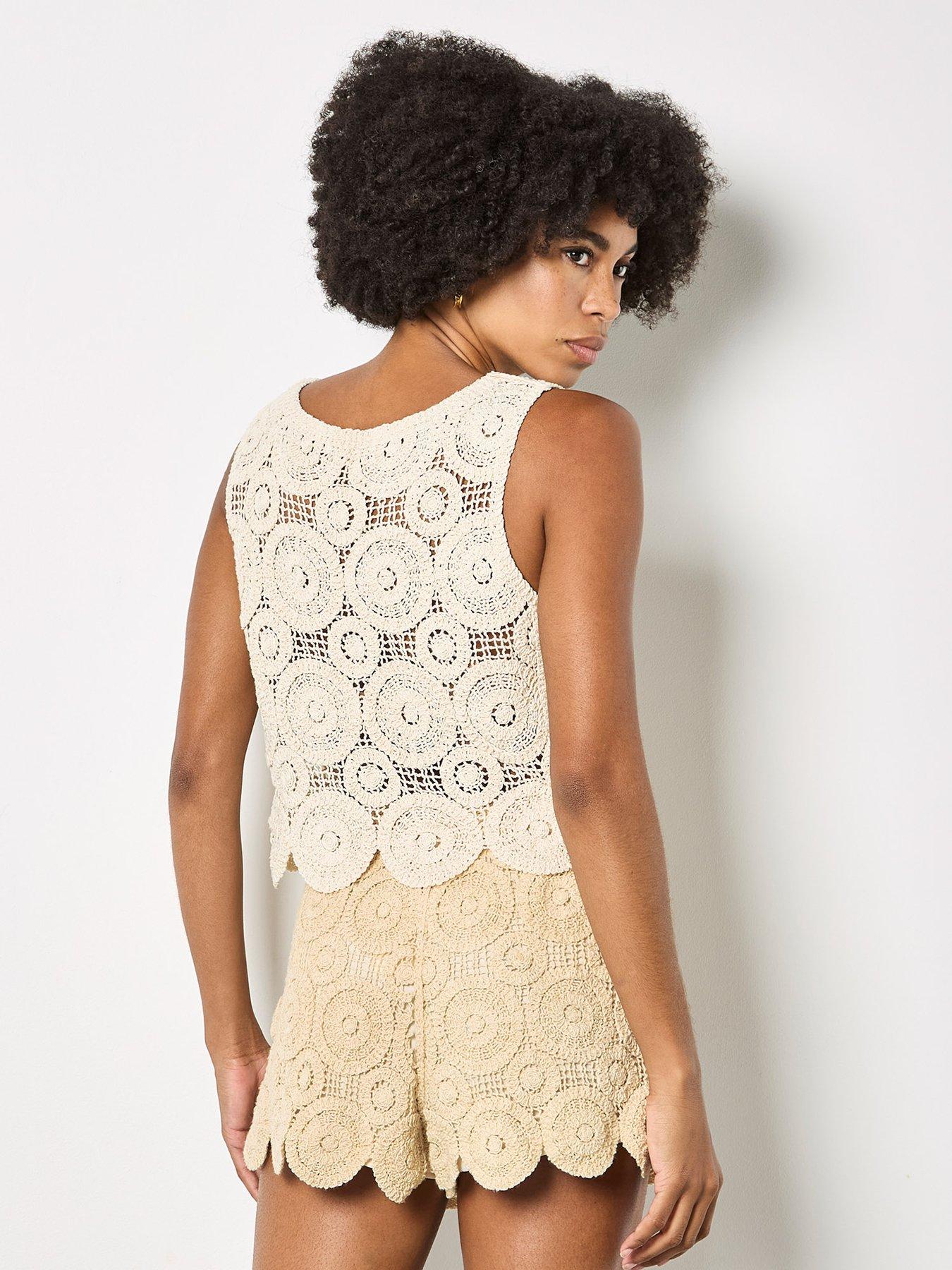  image of apricot-circles-crochet-shell-top-cream