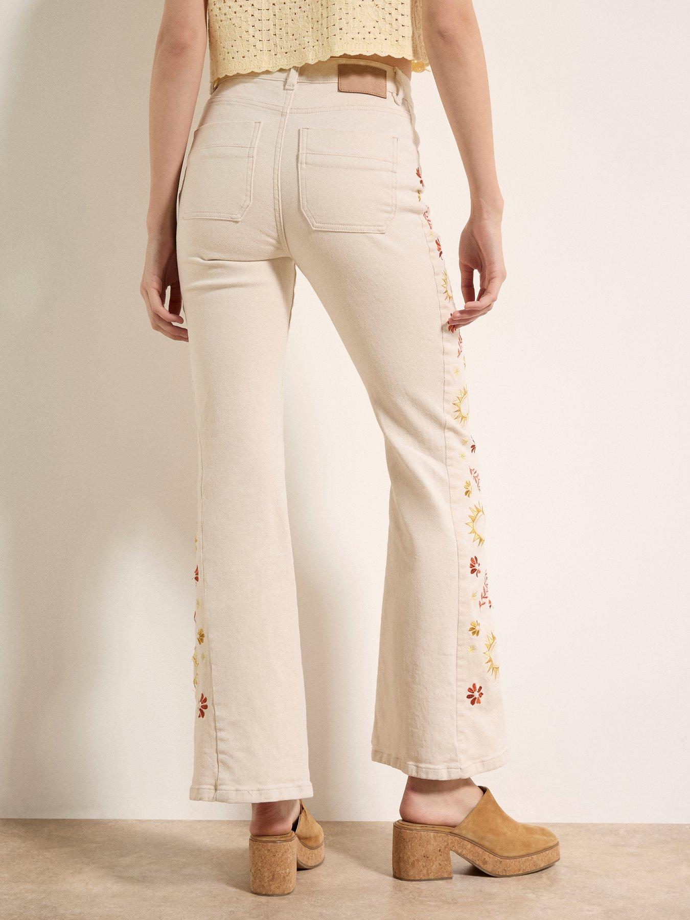  image of apricot-side-embroidered-flare-jeans-cream
