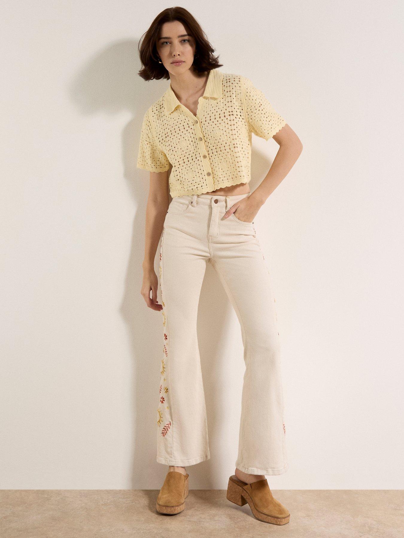  image of apricot-side-embroidered-flare-jeans-cream