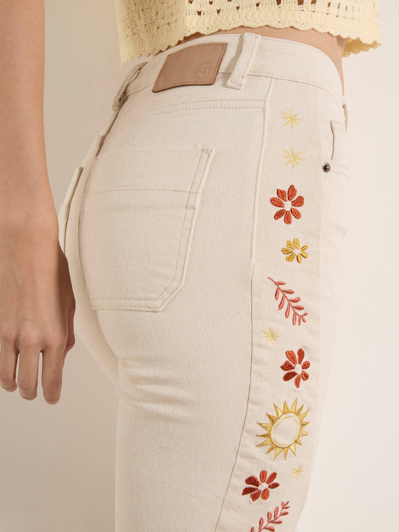  image of apricot-side-embroidered-flare-jeans-cream