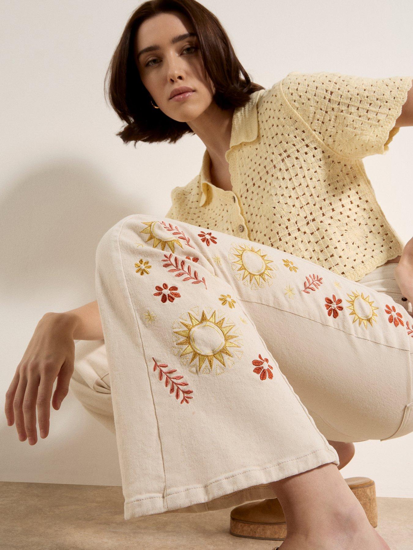  image of apricot-side-embroidered-flare-jeans-cream