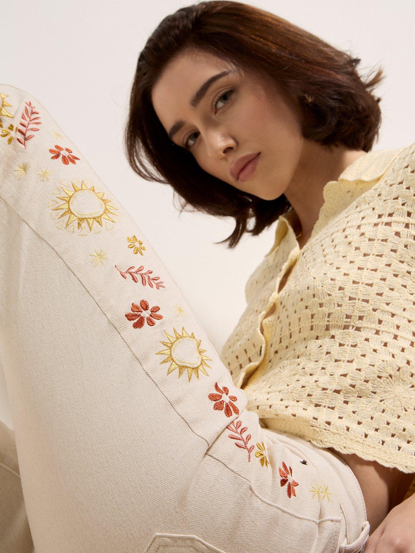 image of apricot-side-embroidered-flare-jeans-cream