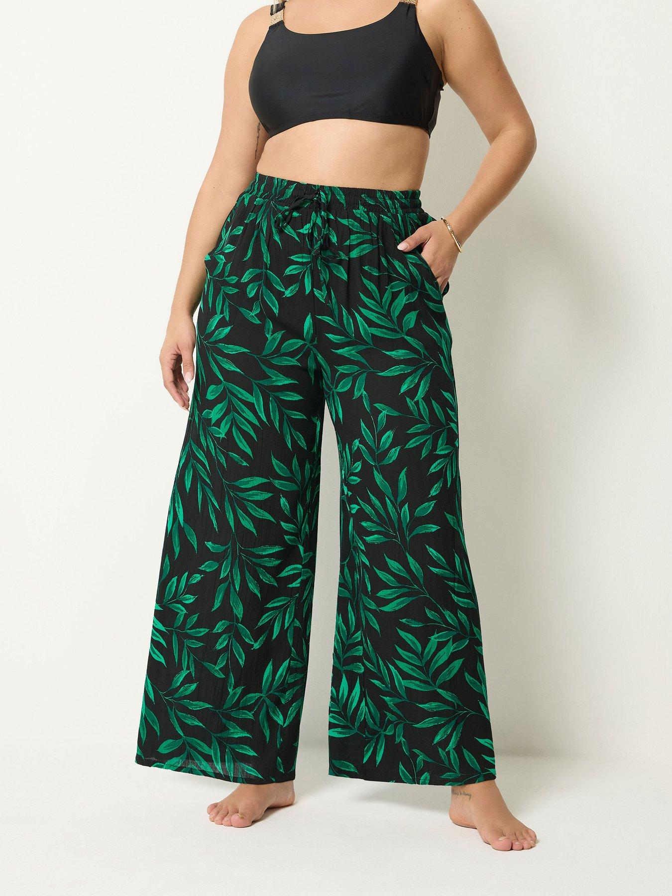 Image 1 of 4 of Yours Curve Leaf Print Wide Leg Crinkle Trousers - Black