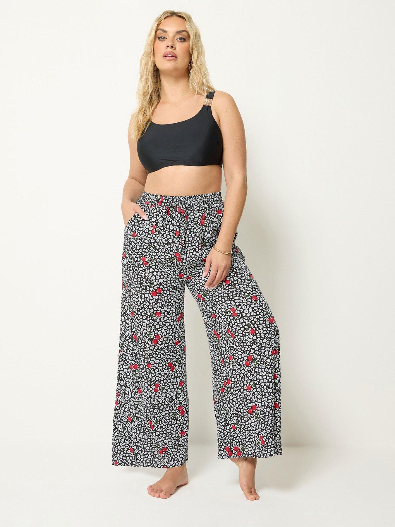 Image 1 of 4 of Yours Curve Cherry &amp; Leopard Print Wide Leg Crinkle Trousers - Black
