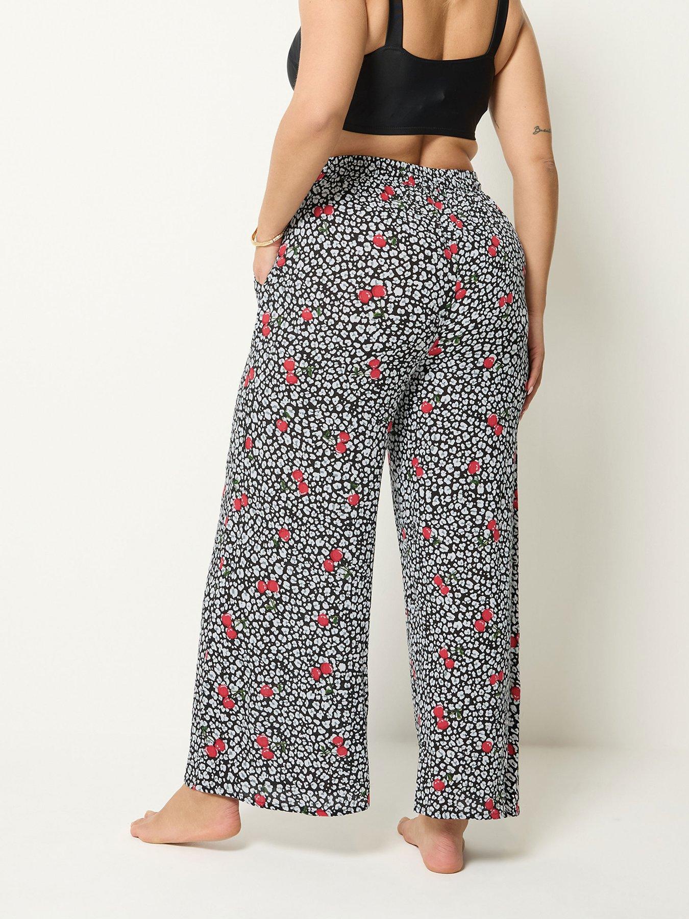 Image 2 of 4 of Yours Curve Cherry &amp; Leopard Print Wide Leg Crinkle Trousers - Black