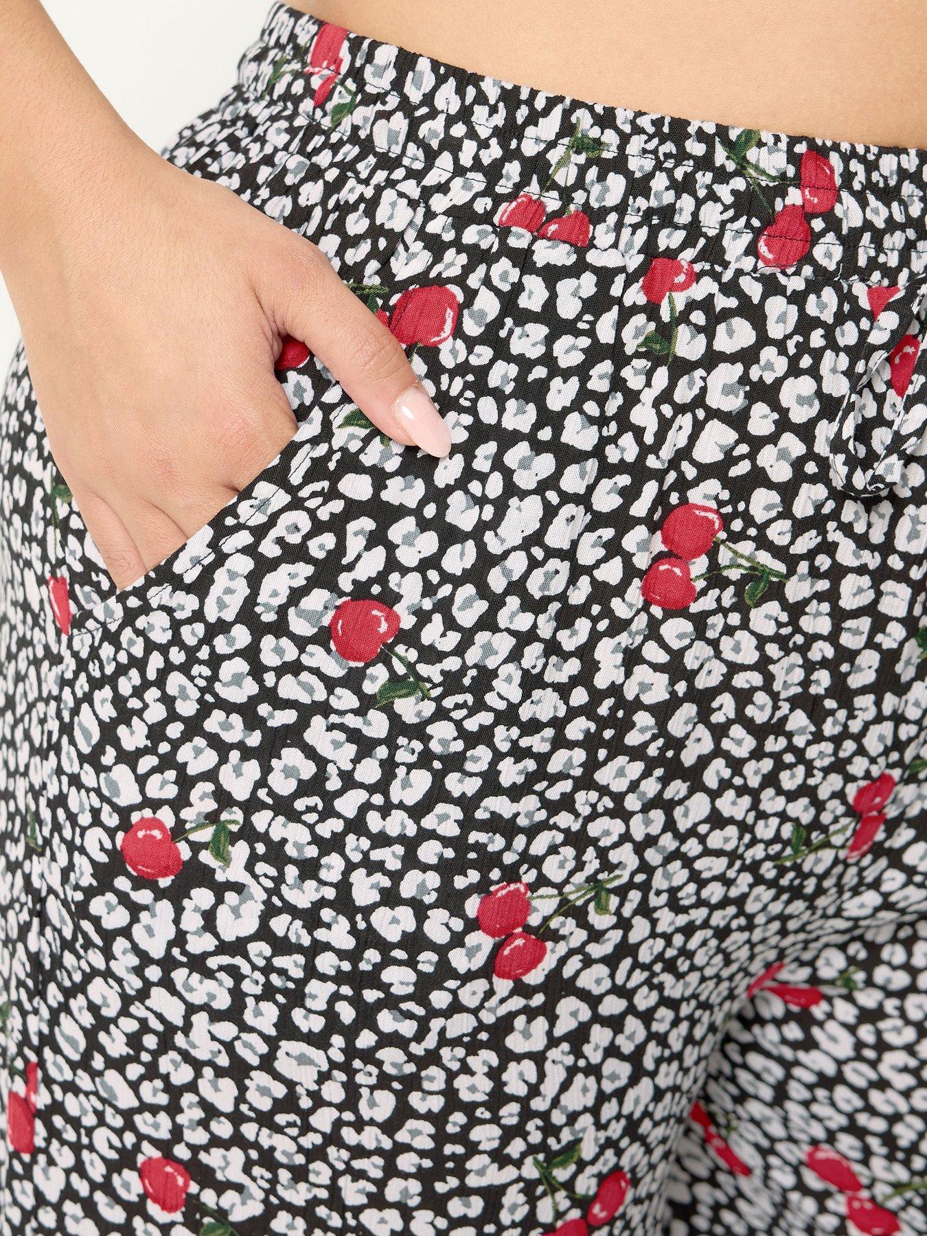 Image 4 of 4 of Yours Curve Cherry &amp; Leopard Print Wide Leg Crinkle Trousers - Black