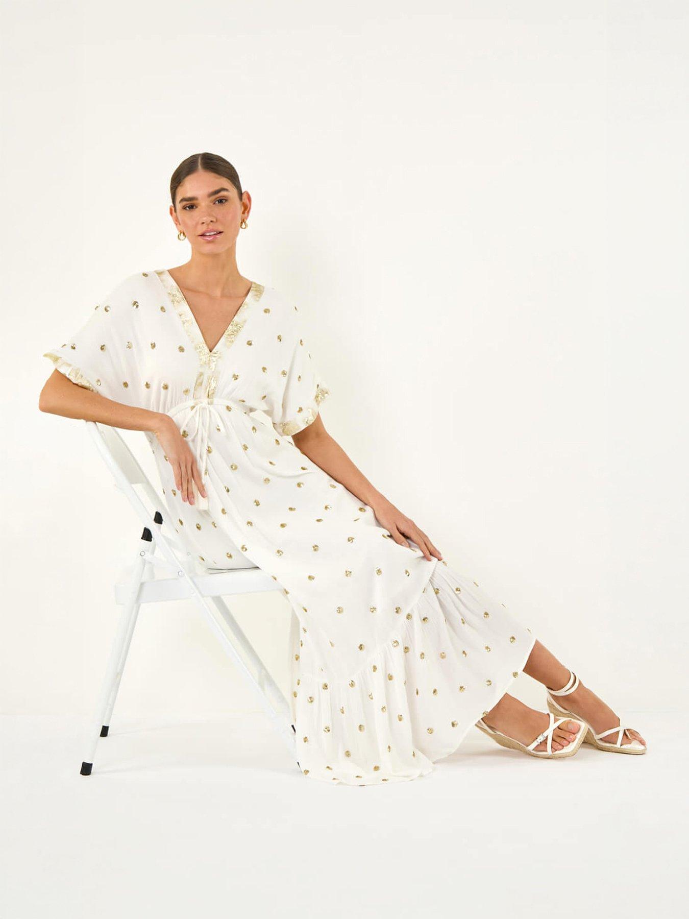 Image 1 of 5 of Roman Sequin Embellished Tassel Midi Dress