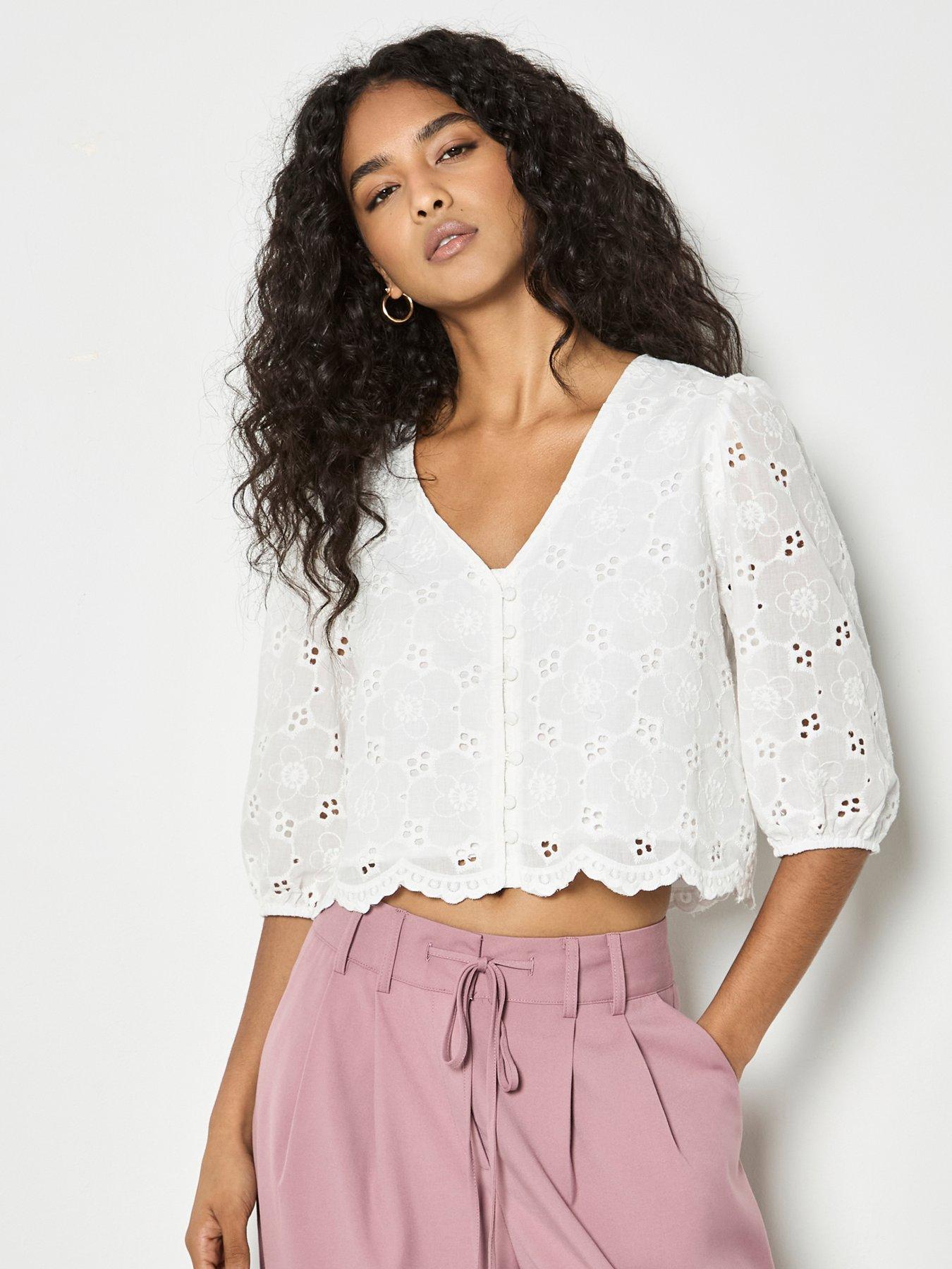 front image of apricot-daisy-broderie-button-top