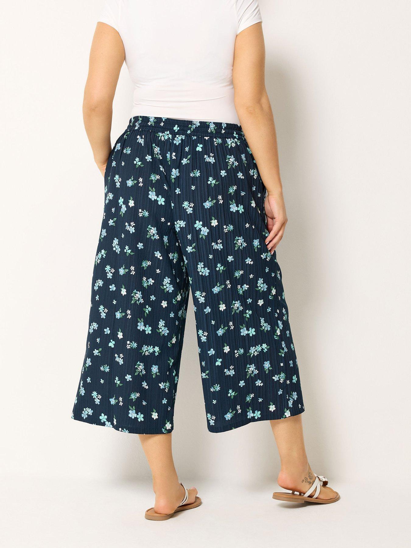 Image 2 of 4 of Yours Curve Crinkle Floral Print Crop Trousers - Blue