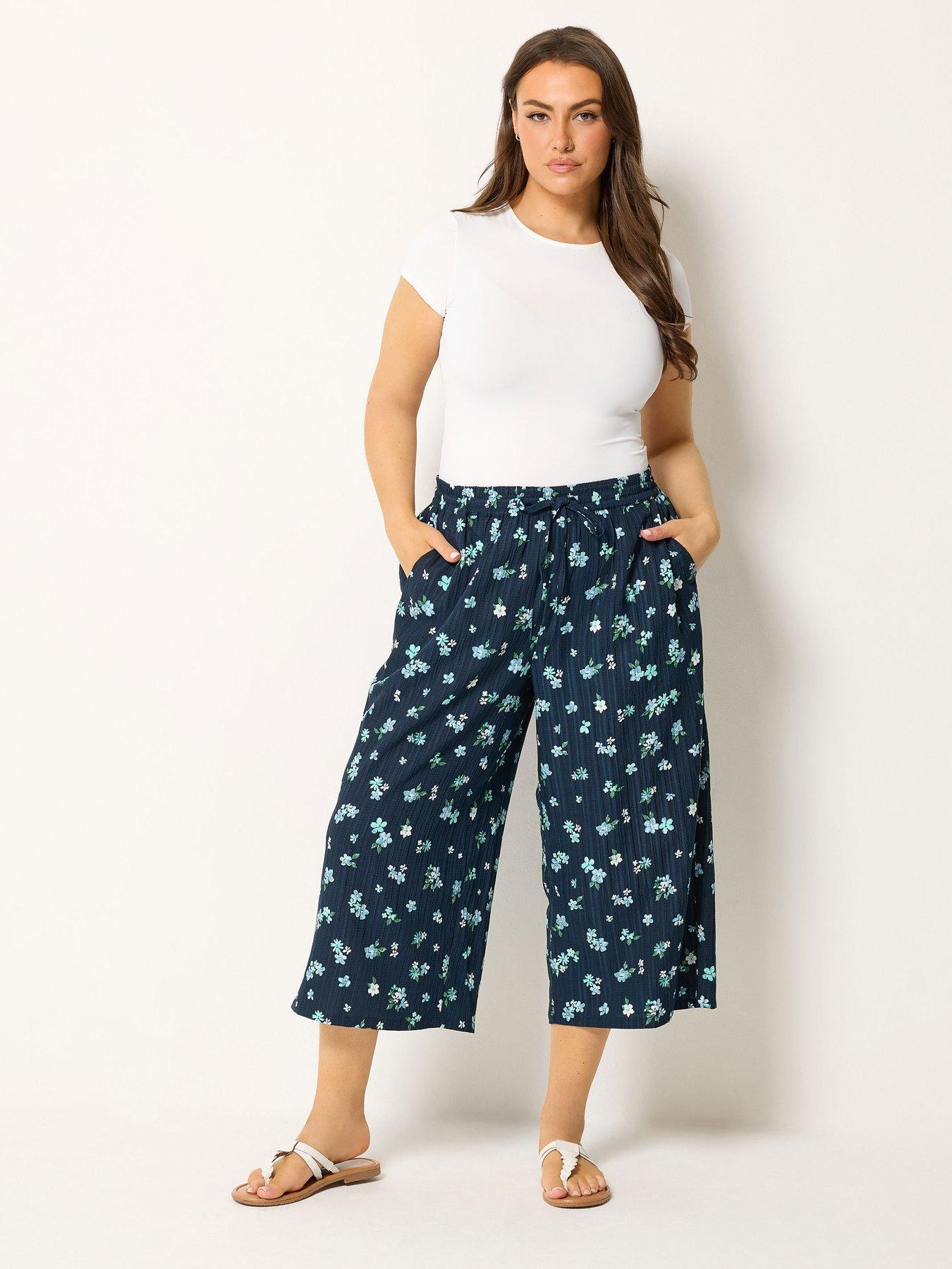 Image 3 of 4 of Yours Curve Crinkle Floral Print Crop Trousers - Blue
