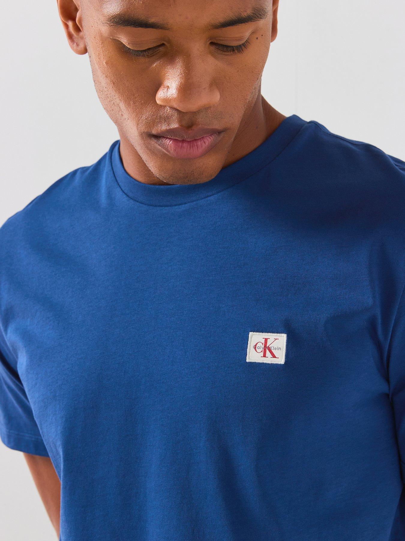 Image 4 of 5 of Calvin Klein Jeans Left Chest Woven Badge T-shirt - Blue