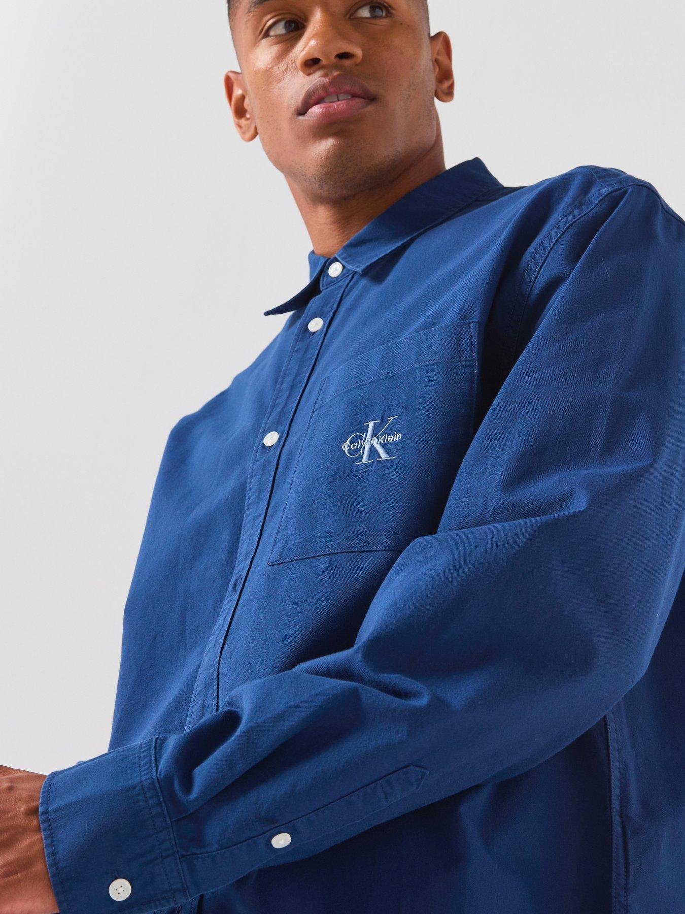Image 4 of 6 of Calvin Klein Jeans Long Sleeve Solid 90s Fit Washed Oxford Shirt - Light Blue
