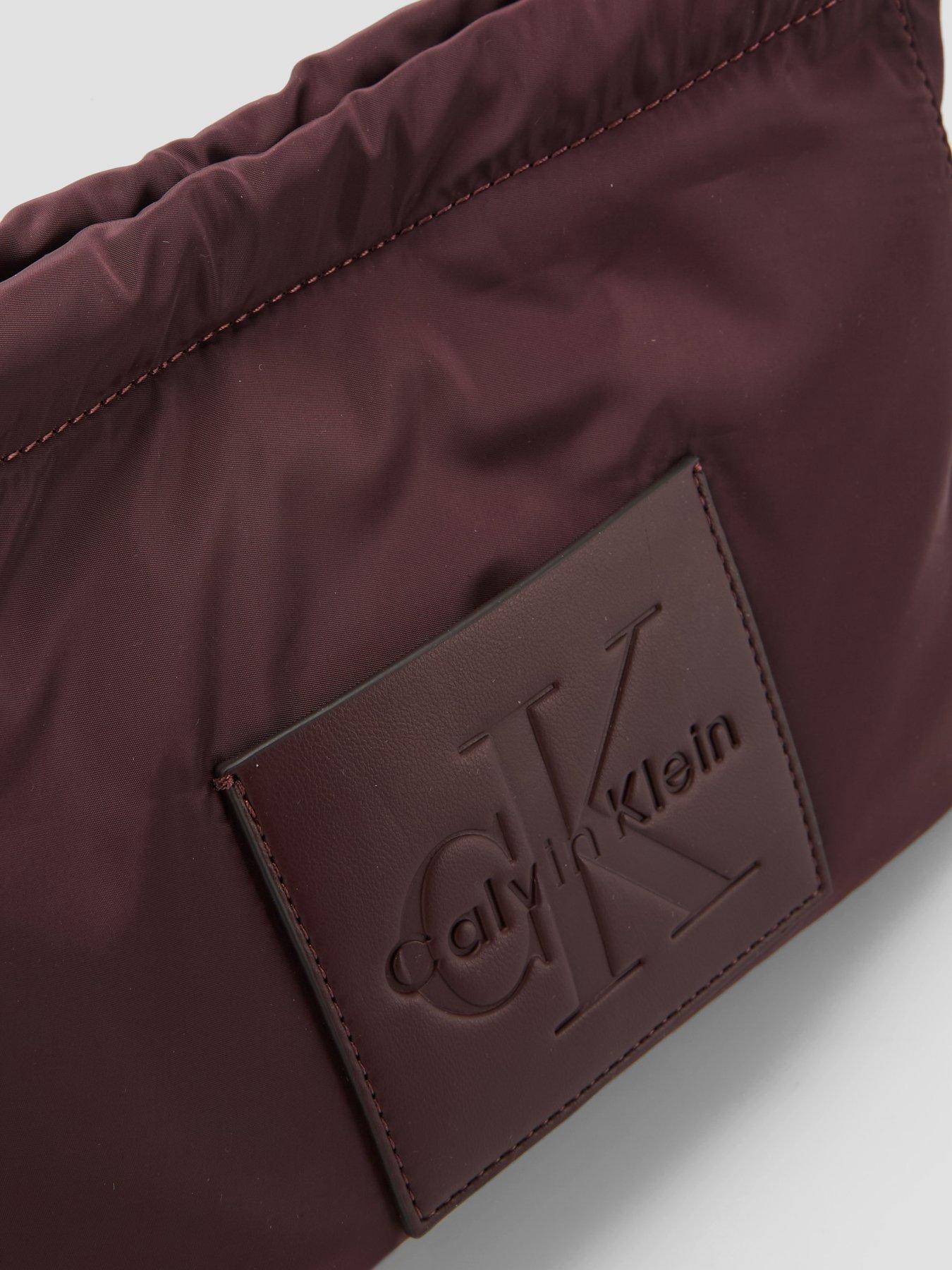 Image 2 of 5 of Calvin Klein Monologo Pocket Drawstring Crossbody Bag - Brown