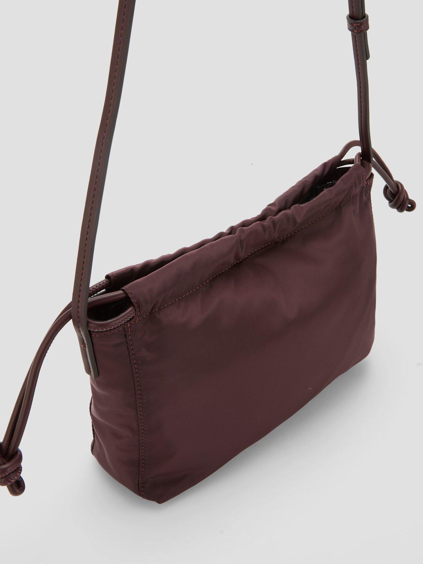 Image 3 of 5 of Calvin Klein Monologo Pocket Drawstring Crossbody Bag - Brown