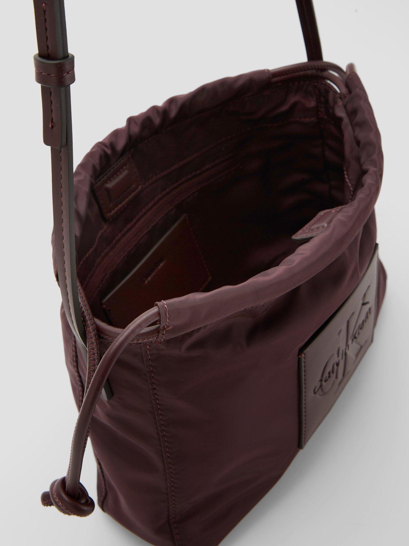 Image 4 of 5 of Calvin Klein Monologo Pocket Drawstring Crossbody Bag - Brown