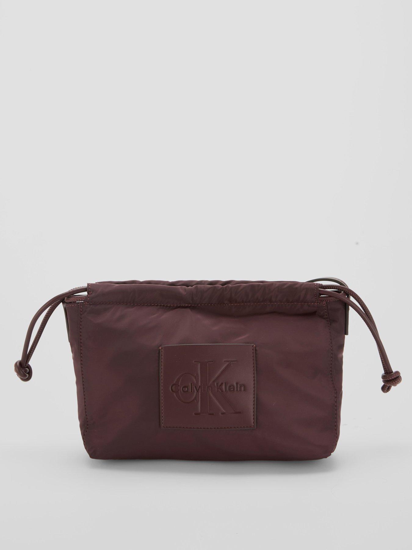 Image 5 of 5 of Calvin Klein Monologo Pocket Drawstring Crossbody Bag - Brown