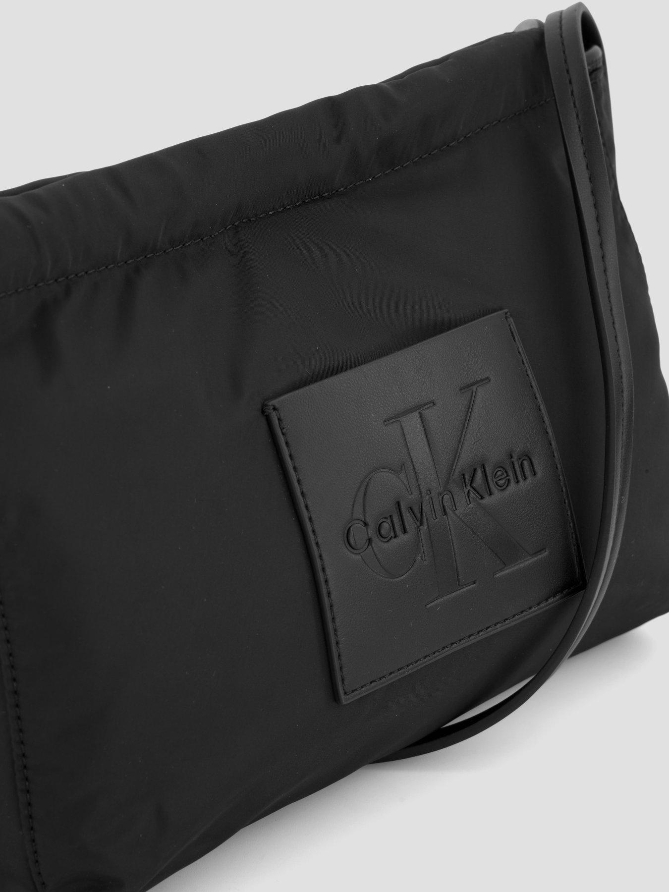 Image 2 of 6 of Calvin Klein Monologo Pocket Drawstring Crossbody Bag - Black