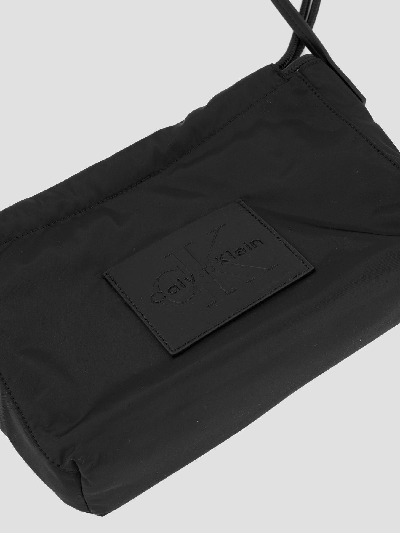 Image 6 of 6 of Calvin Klein Monologo Pocket Drawstring Crossbody Bag - Black
