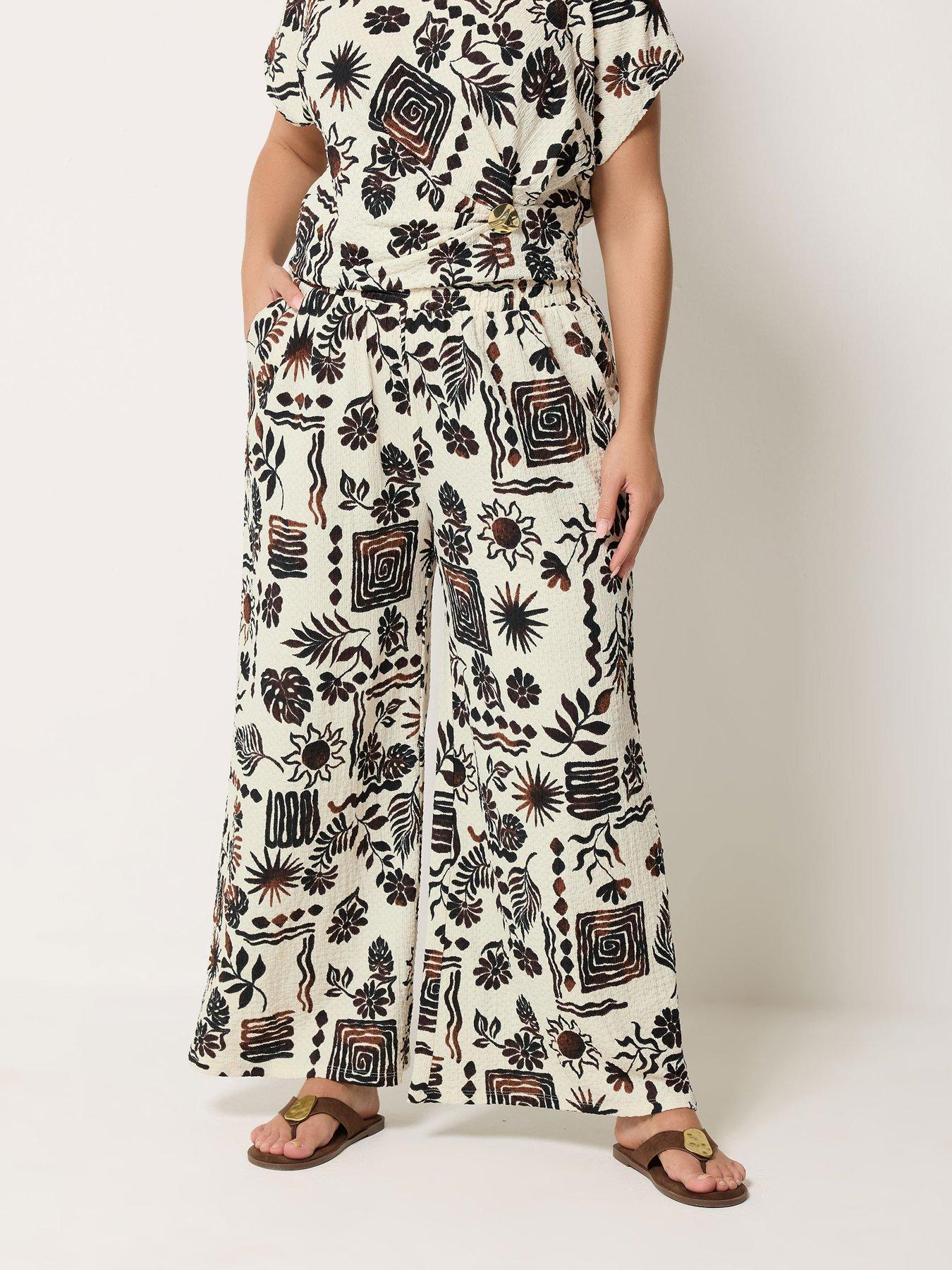 Image 1 of 4 of Yours Curve Natural Brown Summer Print Crinkle Wide Leg Trousers - Brown