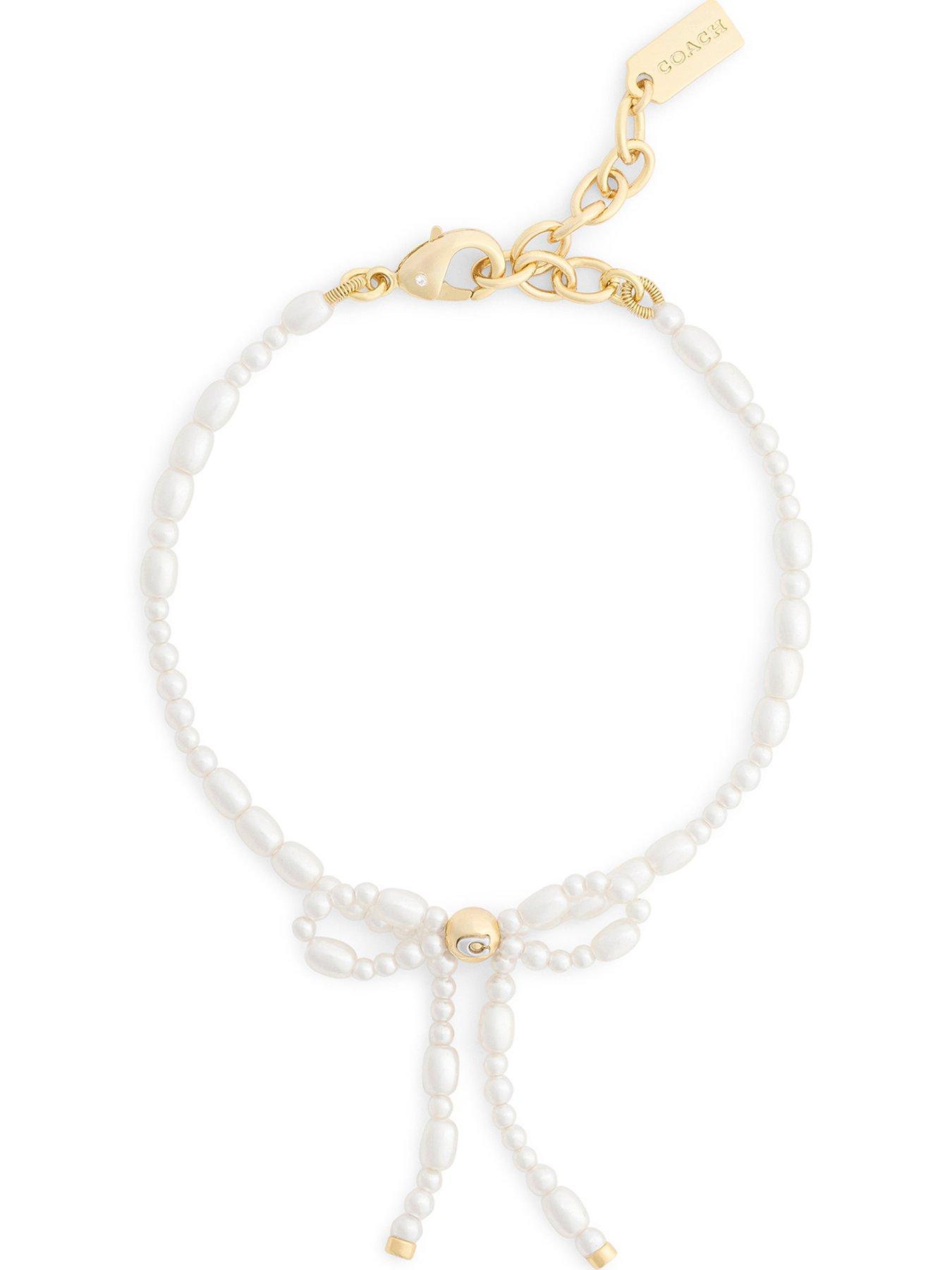 Image 1 of 3 of COACH Pearl Bow Flex Bracelet - Gold