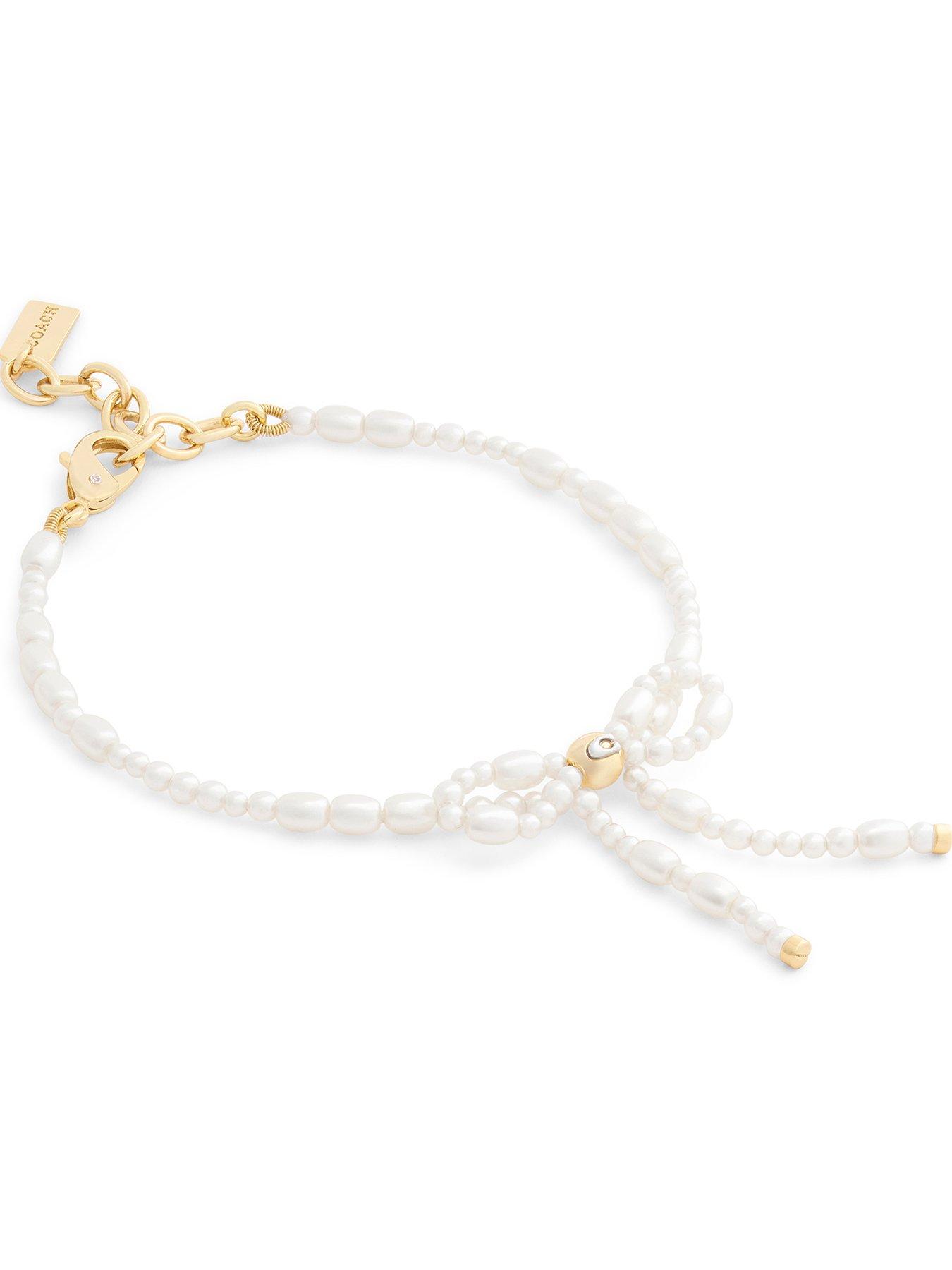 Image 2 of 3 of COACH Pearl Bow Flex Bracelet - Gold