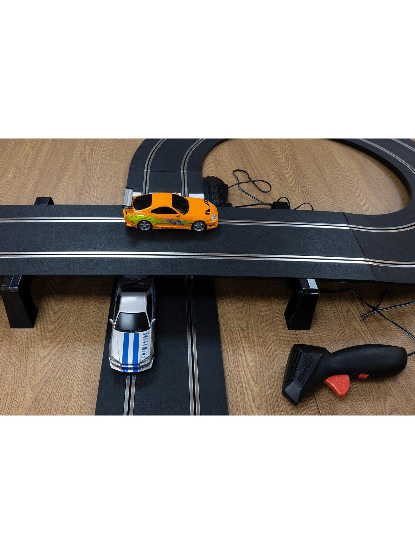 Image 4 of 7 of Scalextric Fast and Furious - 25 Years - Supra vs R34