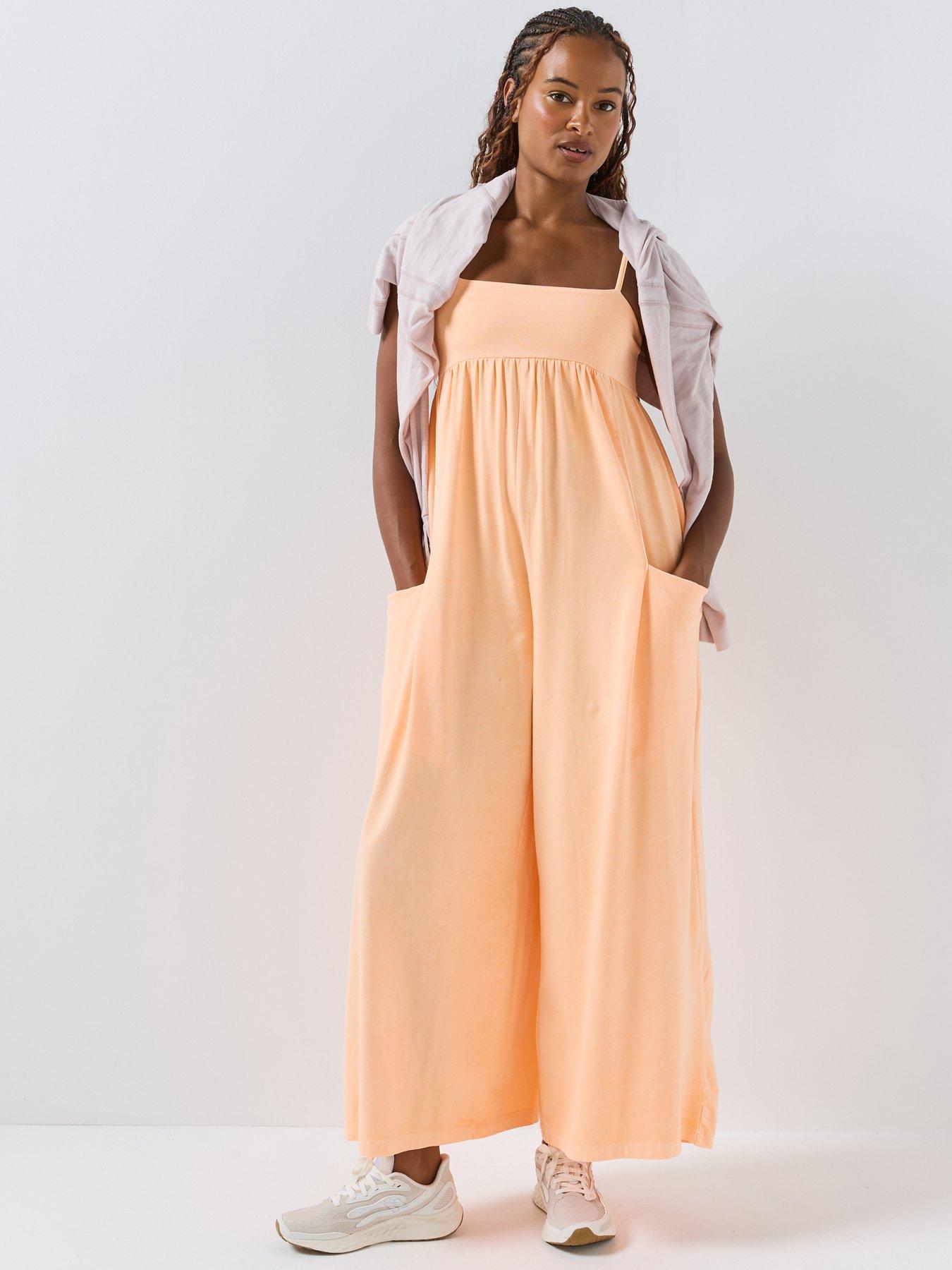 Image 1 of 6 of FP Movement Womens Strappy Square Neck Stretch Jumpsuit - Orange