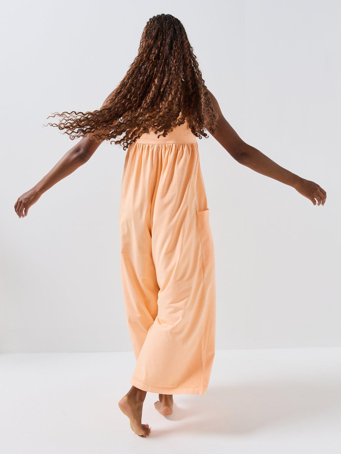 Image 5 of 6 of FP Movement Womens Strappy Square Neck Stretch Jumpsuit - Orange