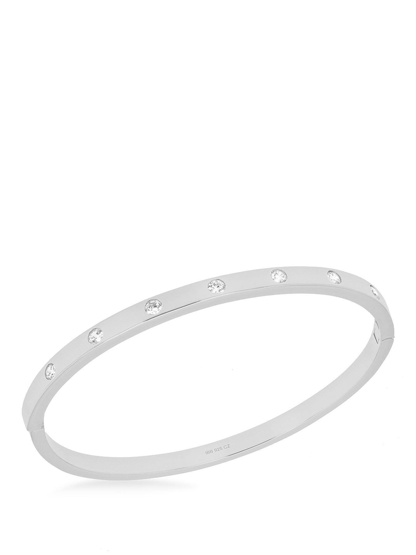 The Love Collection Sterling Silver Rhodium Plated 3mm CZ 7-Stone 4mm Bangle