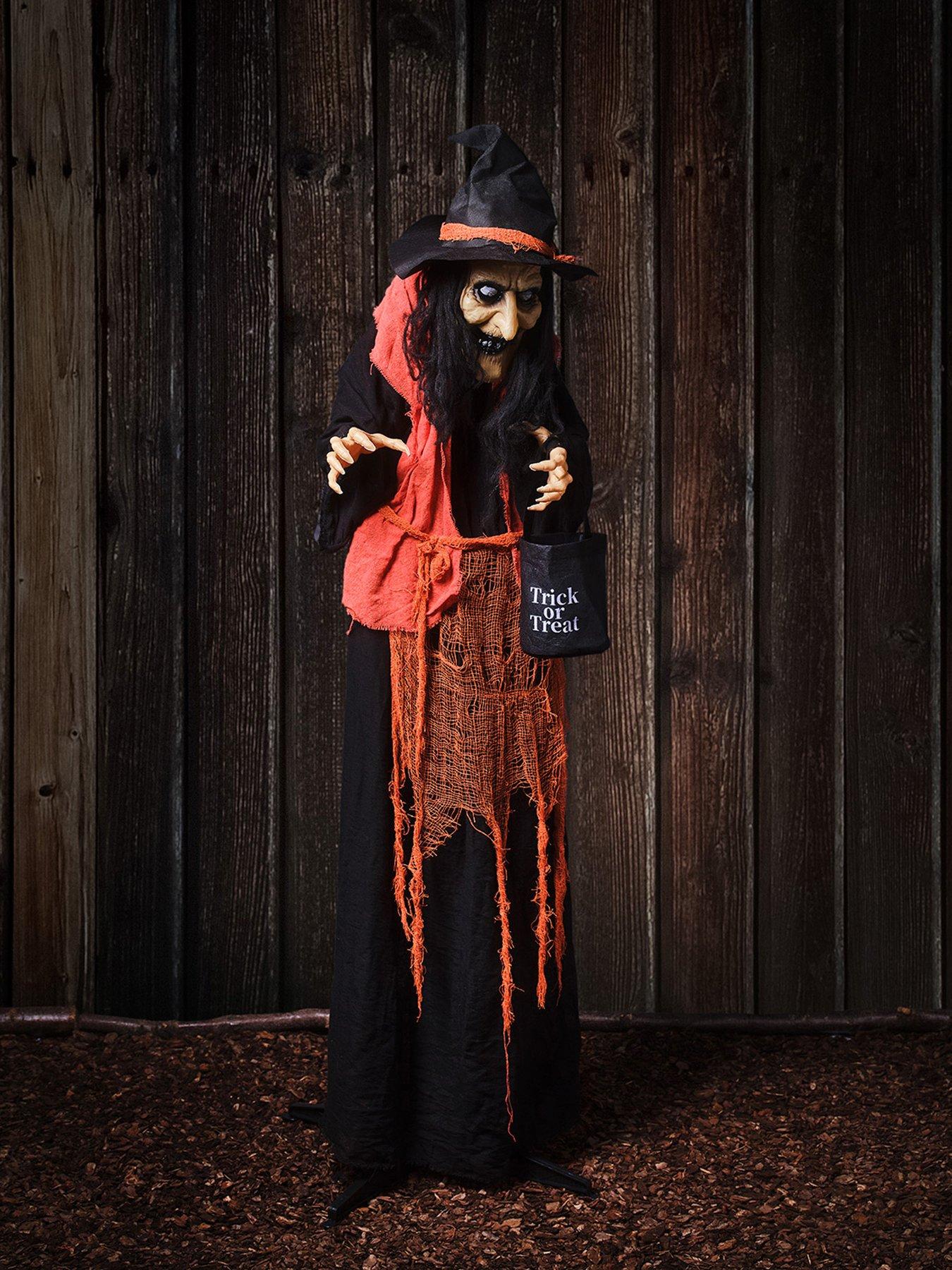 Image 1 of 6 of Lights4Fun 1.6m Animated Witch With Candy Bag Halloween Decoration