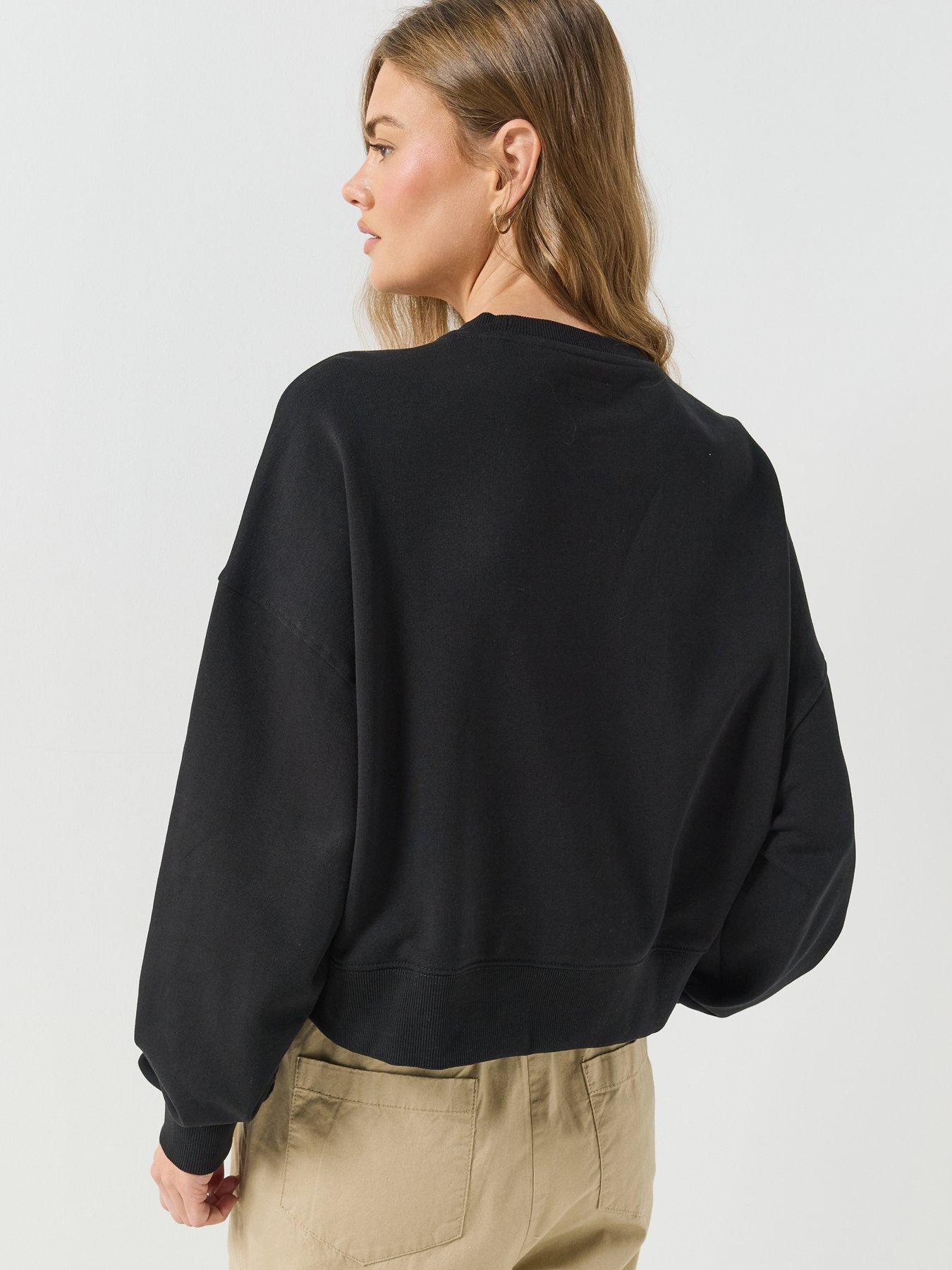 Image 2 of 6 of Guess Jeans Cropped Drop Shoulder Leopard Top - Black